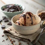 Homemade Chocolate Ice Cream Recipe You’ll Love 6 A scoop of homemade chocolate ice cream with chocolate drizzle